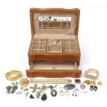 Costume jewellery arranged in a jewellery box including silver ring, silver earrings and