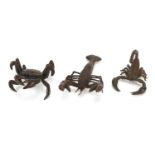 Three Japanese patinated bronze okimonos comprising a crab, scorpion and lobster, each with