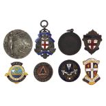 Badges and medallions including an Elkington silver medallion and a silver and enamel London