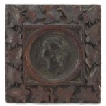Victoria Young Head bronze Madres Exhibition medallion housed in a carved Black Forest frame,