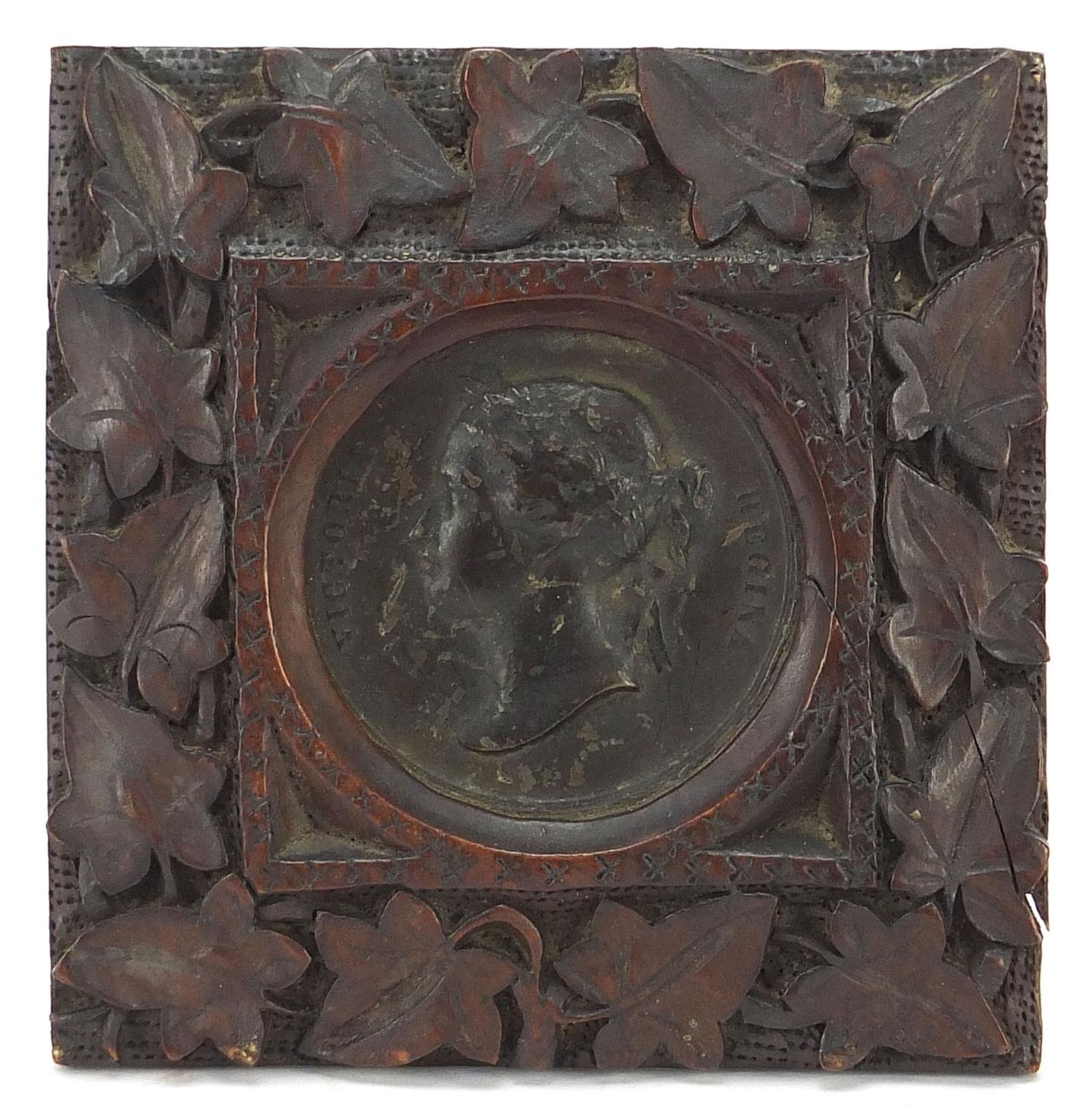 Victoria Young Head bronze Madres Exhibition medallion housed in a carved Black Forest frame,