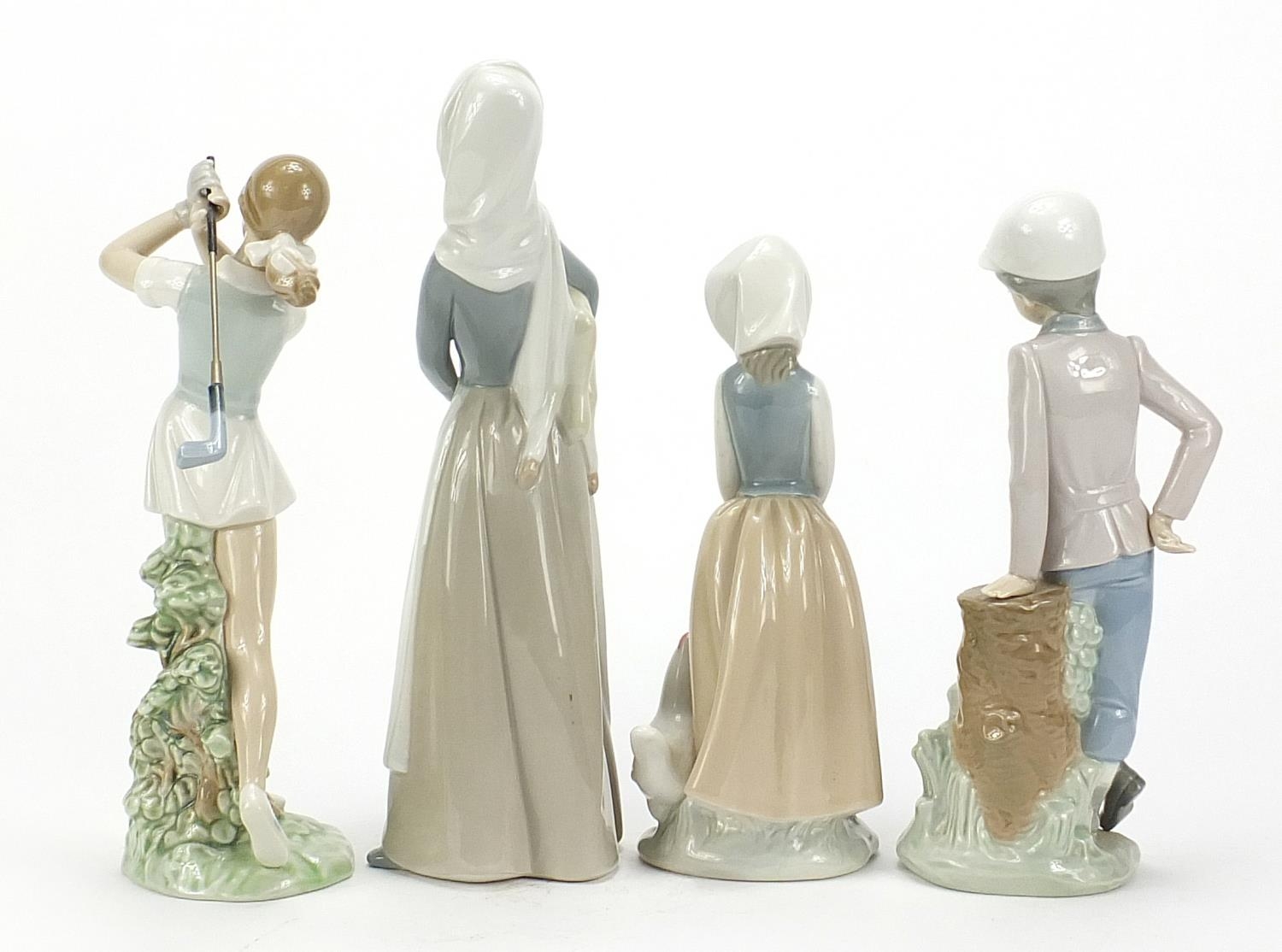 Lladro and Nao china figures including lady with lamb and female golfer, the largest 27.5cm high : - Image 2 of 5
