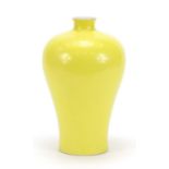 Chinese porcelain Meiping vase having a yellow monochrome glaze, six figure character marks to the