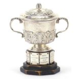 C S Harris & Sons Ltd, Victorian silver twin handled cup and cover raised on an ebonised stand