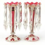 Pair of 19th century Bohemian overlaid cranberry glass lustre vases with cut glass drops, each