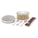 Silver items comprising silver backed brush, comb, three mustard spoons and a silver plated compact,