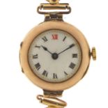 Ladies 9ct gold wristwatch with enamel dial and gold coloured metal strap, 26mm in diameter : For