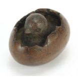 Japanese patinated bronze okimono of a chick with character marks, 5cm in length : For Further
