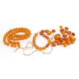 Butterscotch amber coloured beads, the largest 1.8cm in length, total 49.0g : For Further