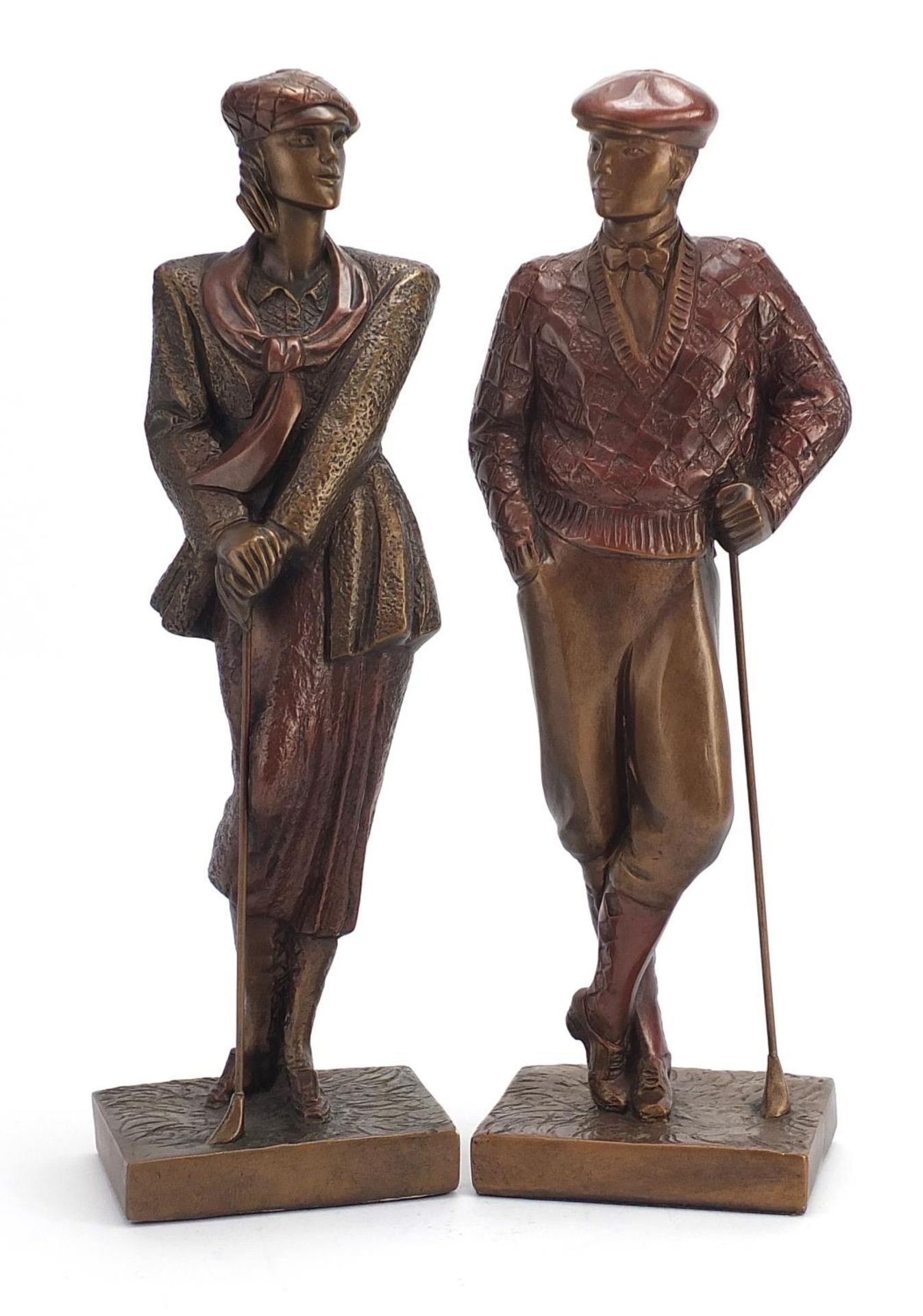 Hand painted plaster figures of golfers, the largest 42cm high : For Further Condition Reports