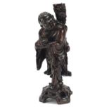 Chinese carved root wood lamp stand in the form of a figure holding a mythical animal, 40.5cm high :