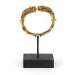 Tibetan gilt bronze dragon bangle on stand, 13.5cm high : For Further Condition Reports Please Visit