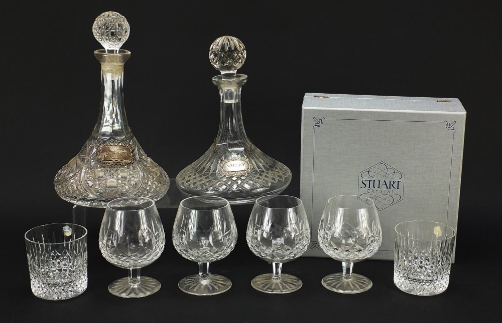 Glassware and a silver brandy decanter label, comprising two ship's decanters, set of four Waterford