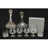 Glassware and a silver brandy decanter label, comprising two ship's decanters, set of four Waterford