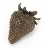 Japanese patinated bronze okimono of a strawberry with character marks, 5.5cm in length : For
