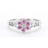 9ct white gold pink sapphire and diamond flower head ring with pierced shoulders, size P, 2.1g : For