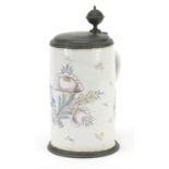 18th century German faience glazed tankard with pewter mounts hand painted with flowers, 26cm high :