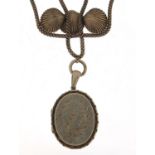 Large Victorian unmarked silver locket on a shell design necklace, 5cm high and 38cm in length,