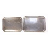 Two rectangular Brazilian silver plated serving trays with canted corners, the largest 57cm wide :