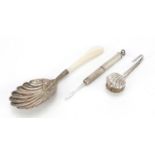 Silver objects comprising Victorian caddy spoon with mother of pearl handle, napkin clip and