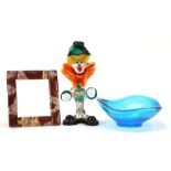 Glassware including a colourful Murano glass clown and a Murano millefiori photo frame, the