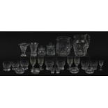 Cut glassware including four Waterford glasses, two jugs and balloon tumblers, the largest 18cm high