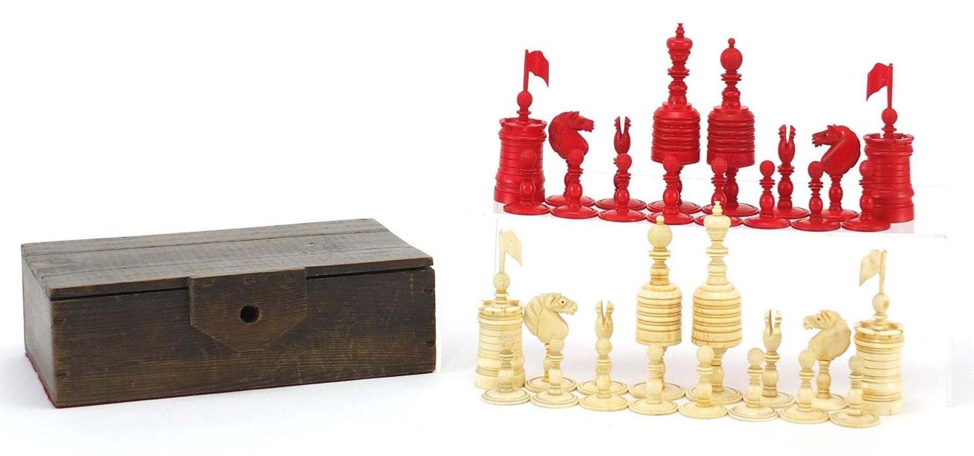 19th century half stained carved bone chess set, the largest pieces each 12cm high : For Further