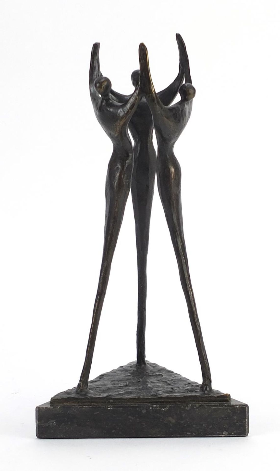 Modernist patinated bronze study of three figures raised on a triangular marble base, 24cm high :