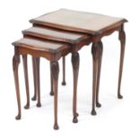 Nest of three mahogany occasional tables with glass tops, the largest 55cm H x 54cm W x 40cm D : For