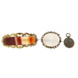 Two antique Scottish agate brooches with gold coloured metal mounts and a Victorian locket with four