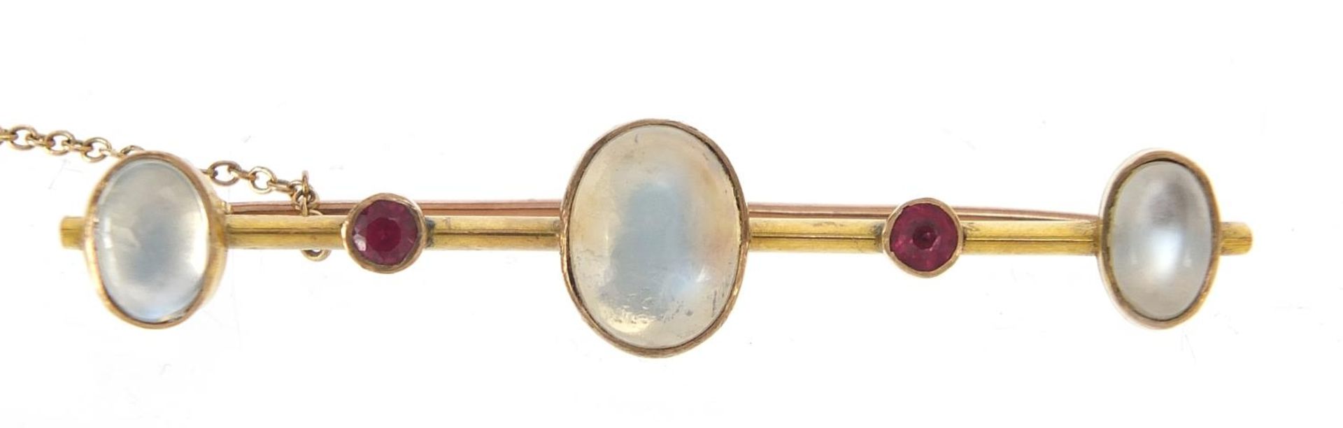 Unmarked gold cabochon moonstone and ruby bar brooch, 5.5cm wide, 5.7g : For Further Condition