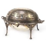 Victorian silver plated revolving breakfast dish, embossed with deities and mythical animals, 32cm