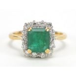 18ct gold emerald and diamond ring, the emerald approximately 8mm x 7mm, the diamonds