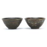 Pair of Chinese patinated bronze bowls decorated with elephants, 6cm in diameter : For Further