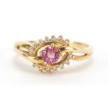 Unmarked gold pink tourmaline and diamond crossover ring, (tests as 14ct+ gold), size N, 3.3g :