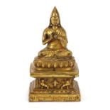 Nepalese gilt bronze figure of seated Buddha, 17.5cm high : For Further Condition Reports Please