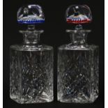 Two Whitefriars cut glass decanters with millefiori paperweight design stoppers, each with date