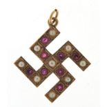 9ct gold ruby and pearl swastika pendant, 3cm high, 3.0g : For Further Condition Reports Please