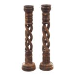 Large pair of carved hardwood floor standing candle holders with twisted columns, each 76.5cm high :