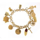 9ct gold charm bracelet with a selection of mostly gold charms including St Christopher, Dutch