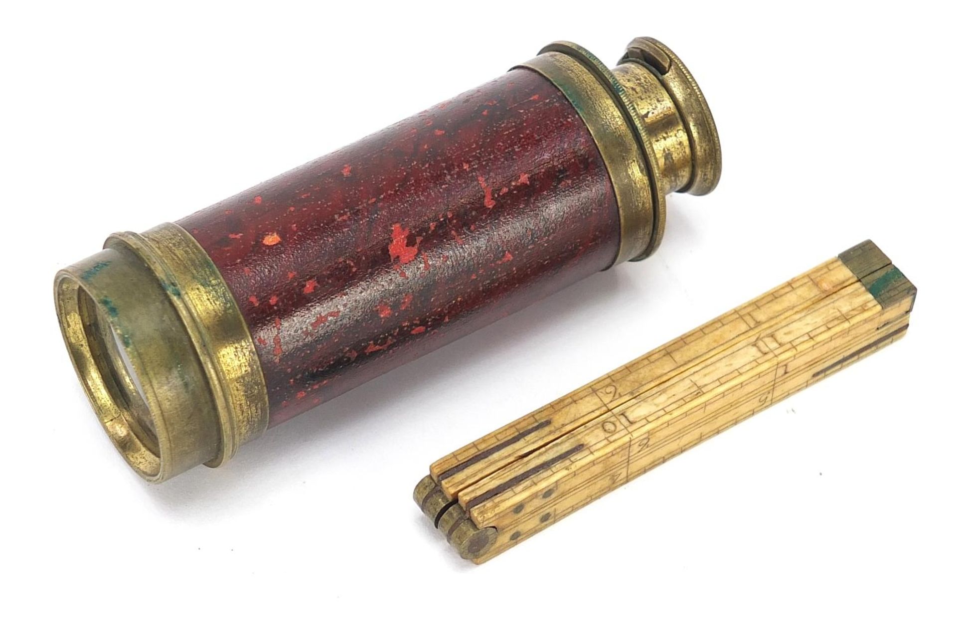 19th century folding ivory rule and two draw brass telescope, the largest 9cm in length when