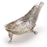 Continental unmarked silver pap boat embossed with Cavaliers, raised on three feet, 9cm wide, 33.