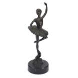 Manner of Edgar Degas, patinated bronze study of a ballerina raised on a circular marble base,