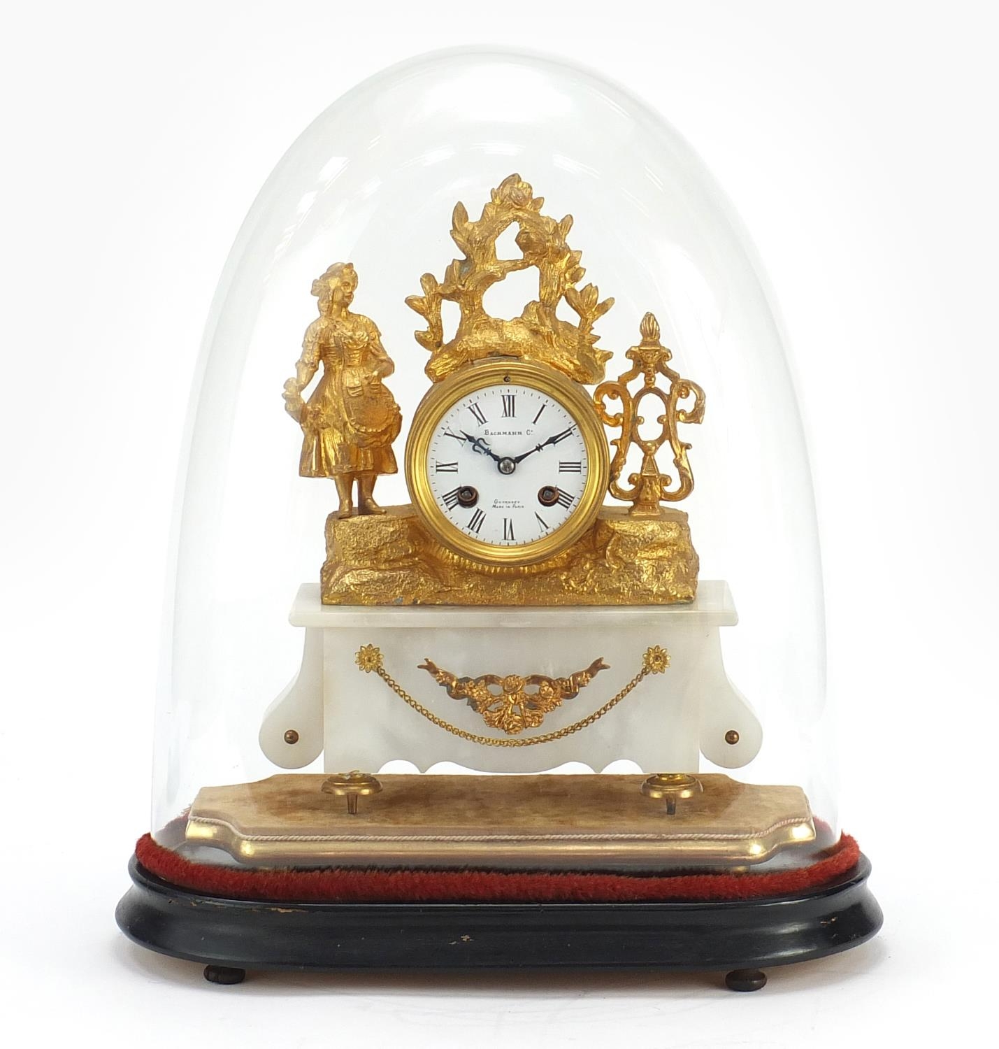 19th century French gilt metal and onyx figural mantle clock raised on a gilt plinth base, housed in