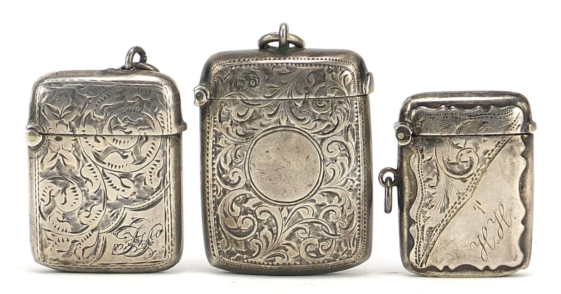 Three Victorian and later silver vestas with engraved decoration, Chester 1899, Birmingham 1898