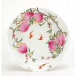 Chinese porcelain shallow dish hand painted in the famille rose palette with two bats amongst