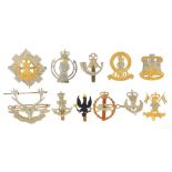 Eleven British military Staybright cap badges including The Royal Scots and The Green Howards :
