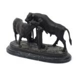 After Pierre Jules Mene, large patinated bronze group of two bulls raised on a shaped marble base,