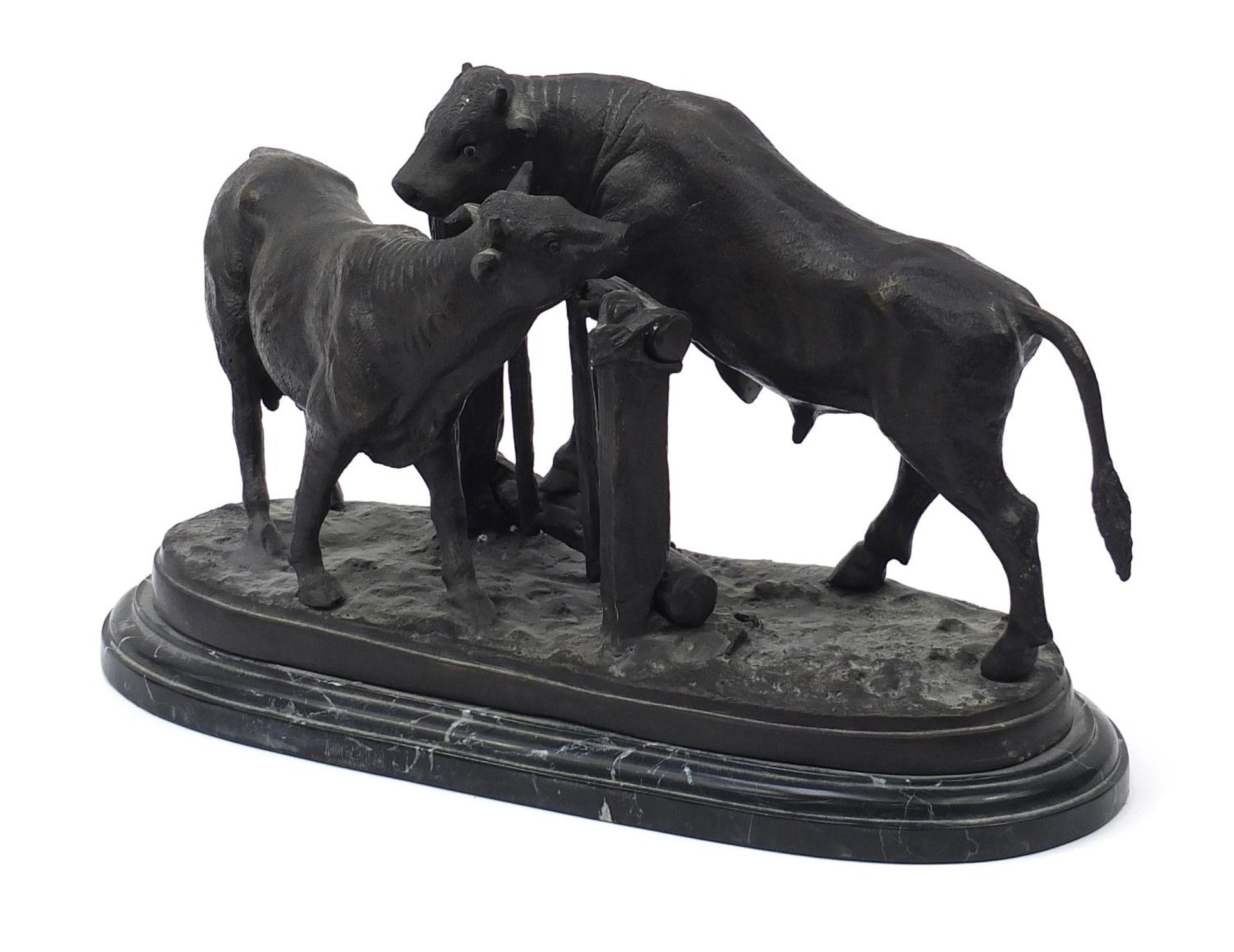 After Pierre Jules Mene, large patinated bronze group of two bulls raised on a shaped marble base,