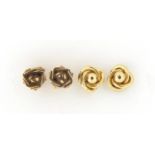 Two pairs of 9ct gold stud earrings including flower heads, the largest 7mm in diameter, total 1.